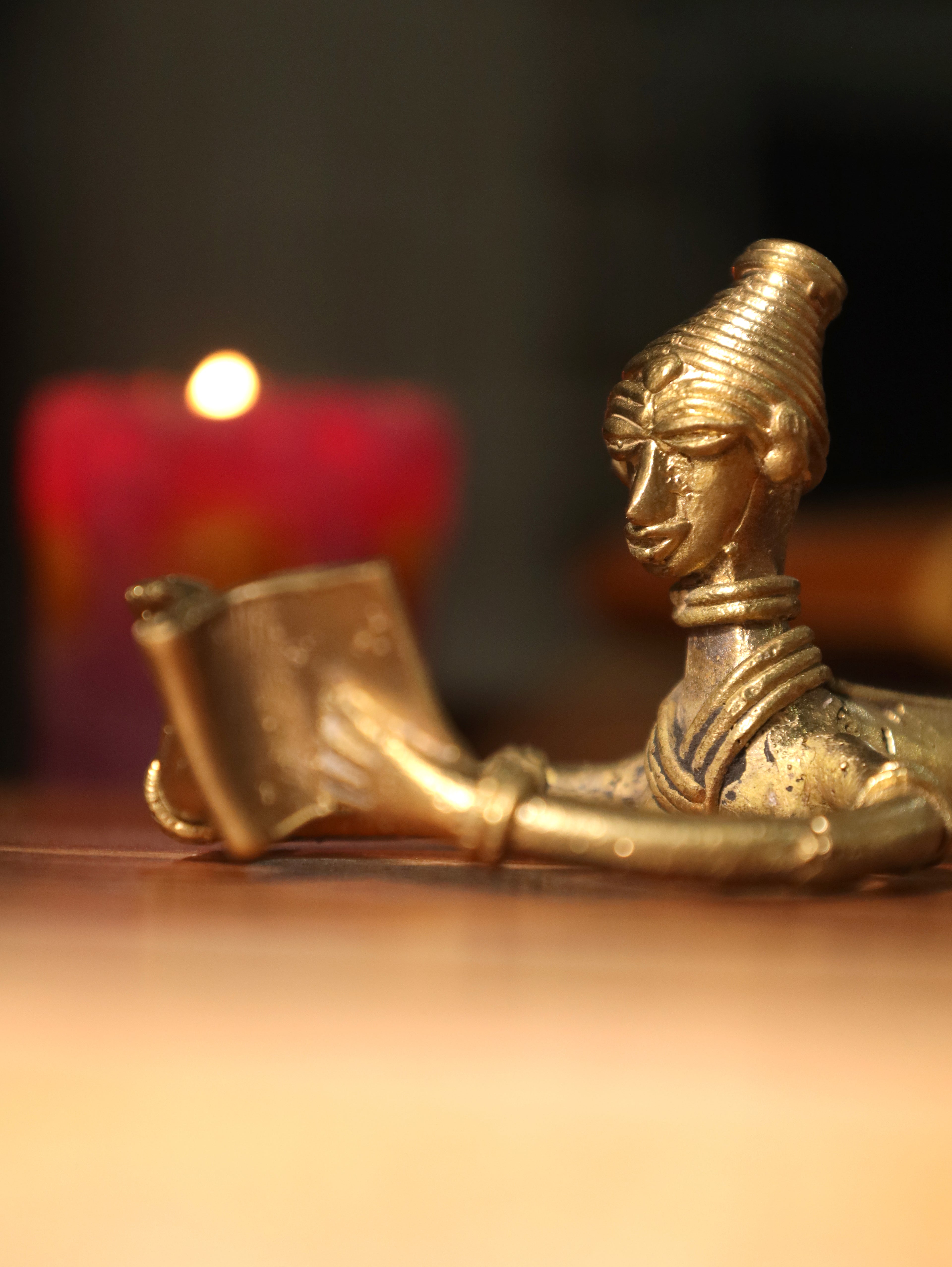 Dhokra Tribal Lady Reading in Sleeping Posture