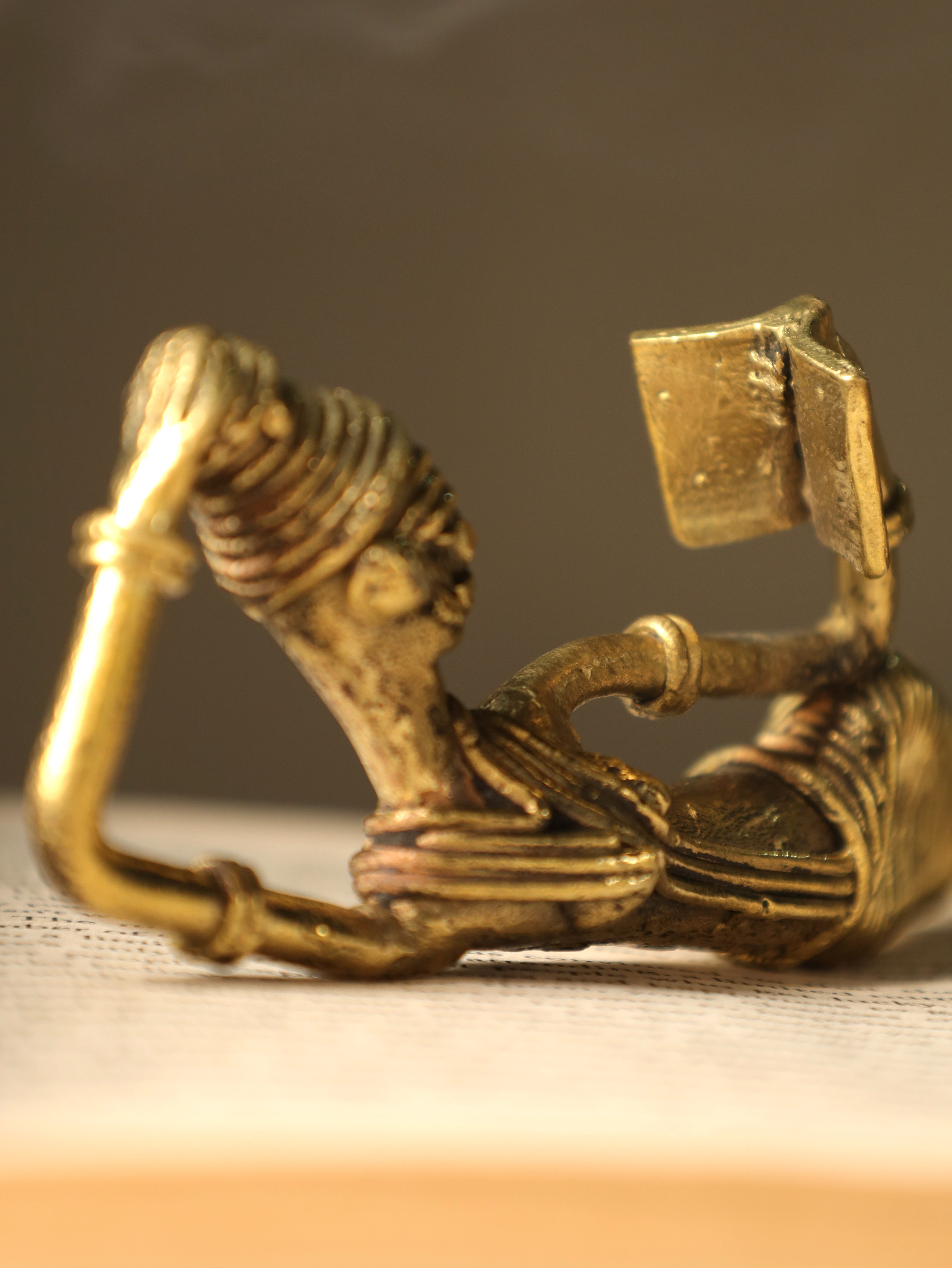 Dhokra Tribal Lady Reading Sideways