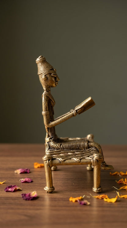 Dhokra Lady Reading on Charpai